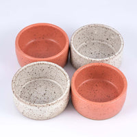 Two sets of Mezcal copitas in speckled white and speckled pink clay