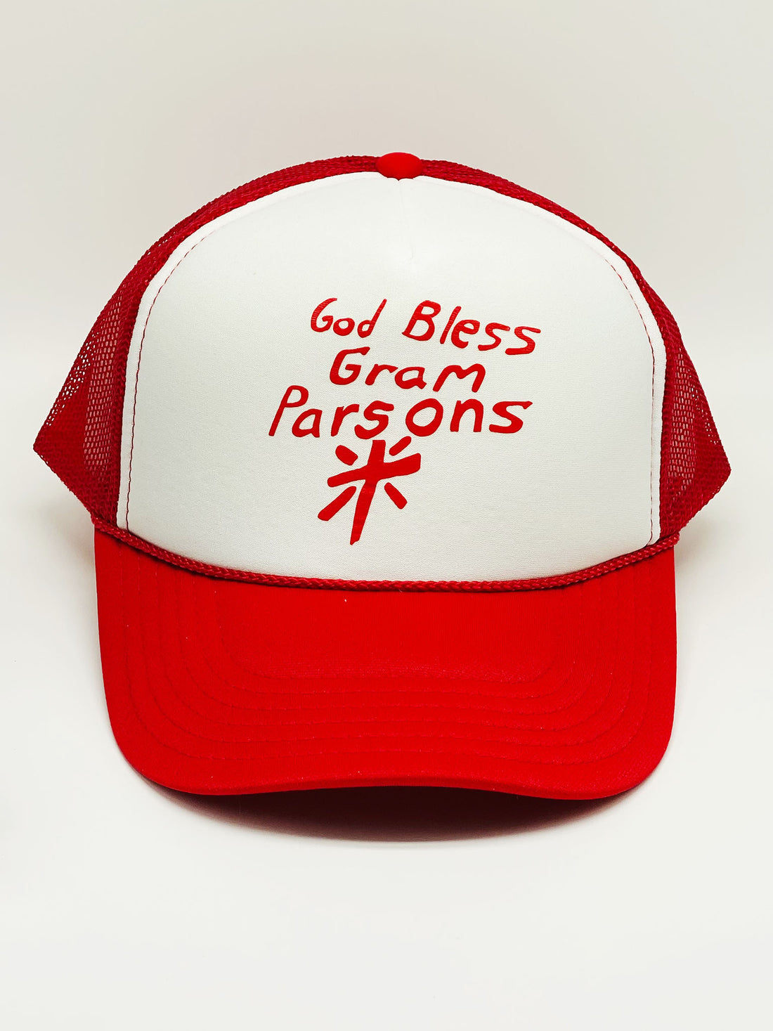 White and red 70s trucker hat with text "God Bless Gram Parsons" and a cross