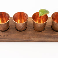 Hammered Copper glasses with lime on walnut cutting board