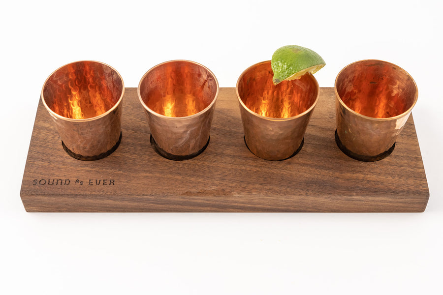 Hammered Copper glasses with lime on walnut cutting board