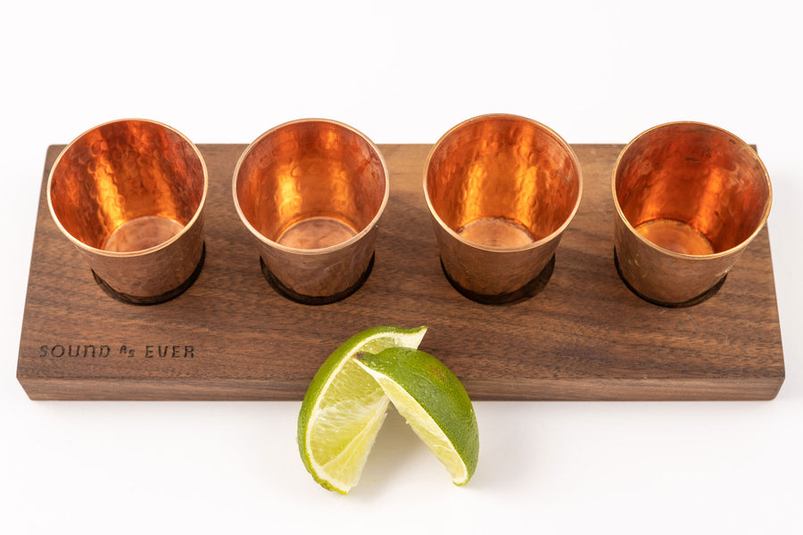 Sound as Ever wooden flight board with copper shot glass and limes