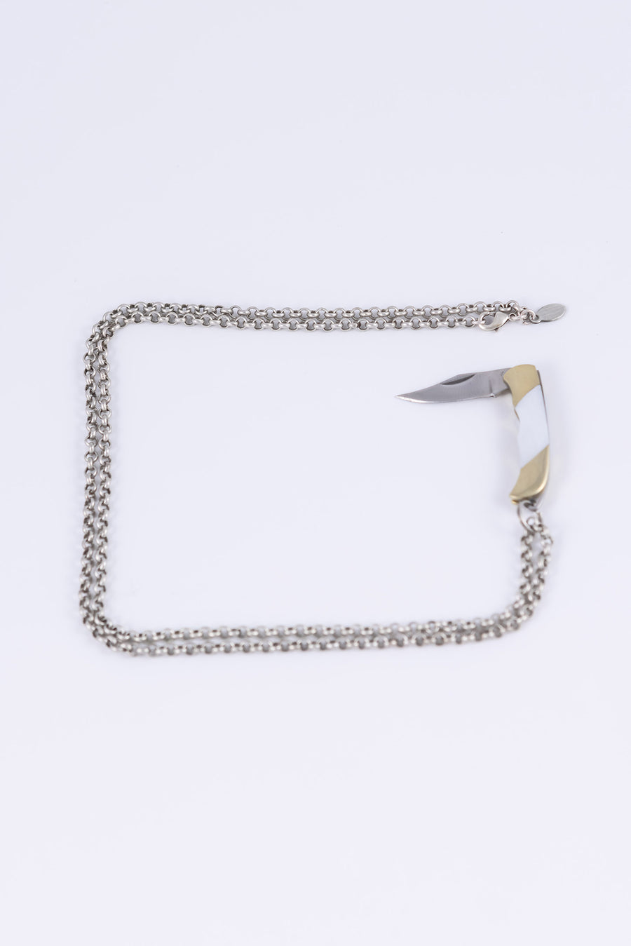 Open folding knife necklace inlaid with mother of pearl on an antiqued silver plated rolo chain with pear clasp