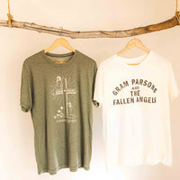 Gram Parsons and the Fallen Angels white distressed tshirt hanging next to Sound as Ever green Sinner Seeker t-shirt