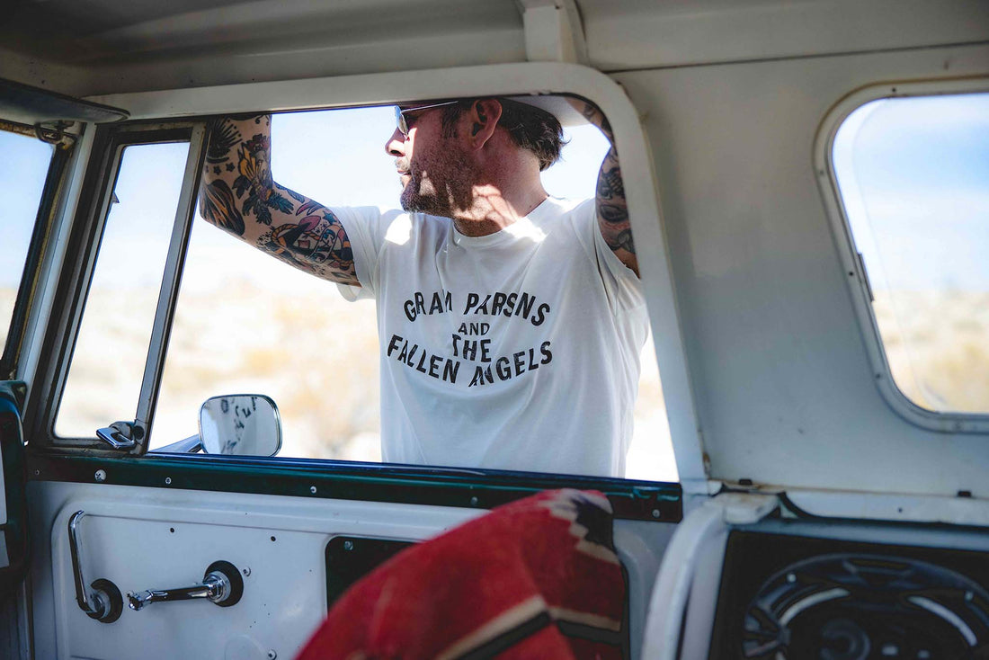 View of a man through a car window wearing Gram Parsons and the Fallen Angels tee