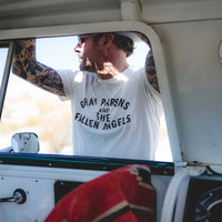 View of a man through a car window wearing Gram Parsons and the Fallen Angels tee