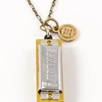 Genuine Hohner harmonica necklace with brass charm with text "Here for Now" 