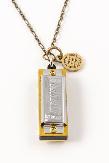 Genuine Hohner harmonica necklace with brass charm with text "Here for Now" 