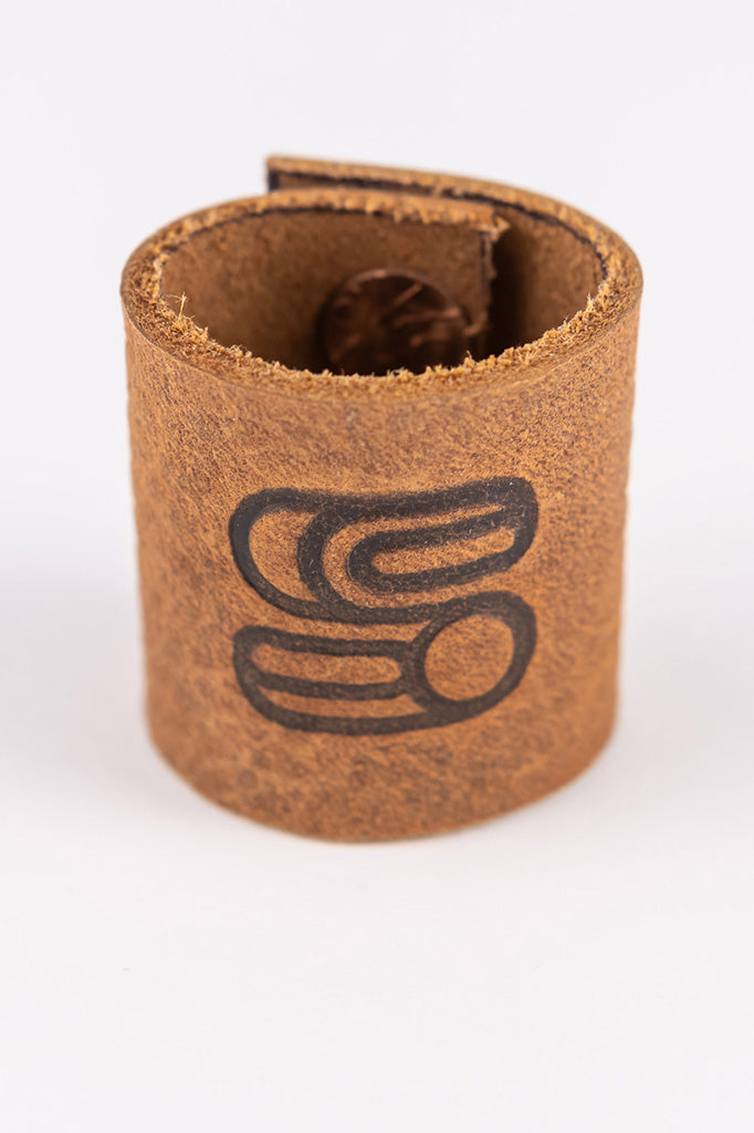 Front view of the brown leather bandana slide with Sound As Ever logo