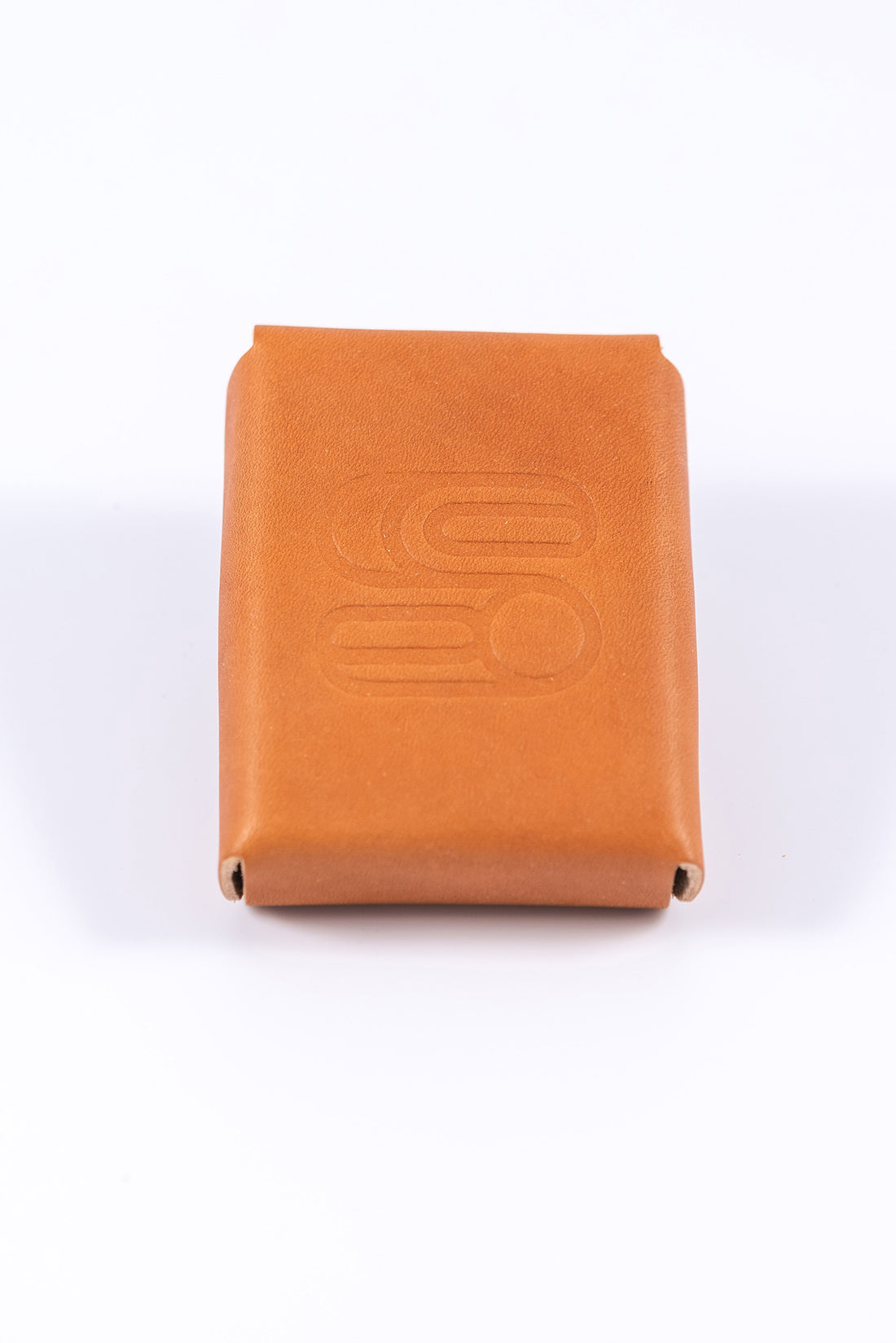 Leather playing card case made from light brown vegetable tanned leather embossed with the Sound As Ever logo