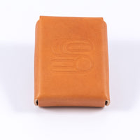 Leather playing card case made from light brown vegetable tanned leather embossed with the Sound As Ever logo