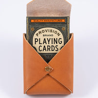 Leather playing card case open to display the premium playing cards from Theory11 Provision brand