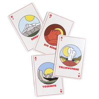 Four National park playing cards showing minimalist illustrations of Denali, Big Bend, Yellowstone, and Yosemite