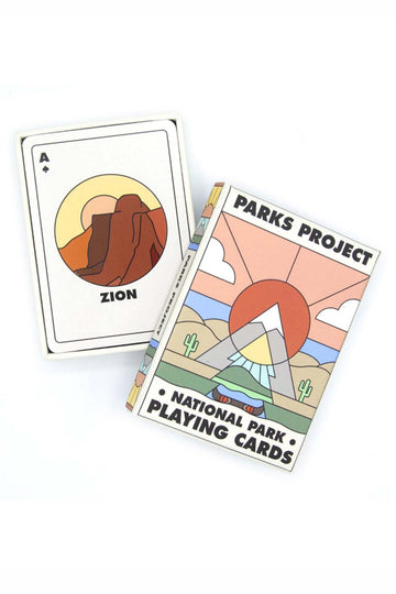 National Park playing cards showcasing the illustration for Zion national park next to the box with a design of mountains, cacti, and greenery