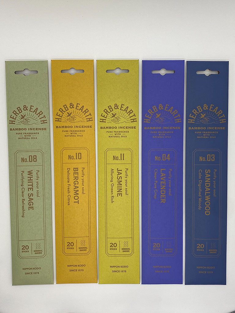 Colorful packs of natural incense sticks in scents white sage, bergamot, jasmine, lavender, and sandalwood