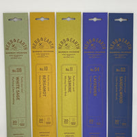 Colorful packs of natural incense sticks in scents white sage, bergamot, jasmine, lavender, and sandalwood