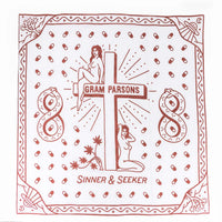 Sound As Ever Sinner & Seeker organic cotton bandana in the desert. The design has two women next to a cross, joshua trees, UFOs, and snakes in an infinity shape