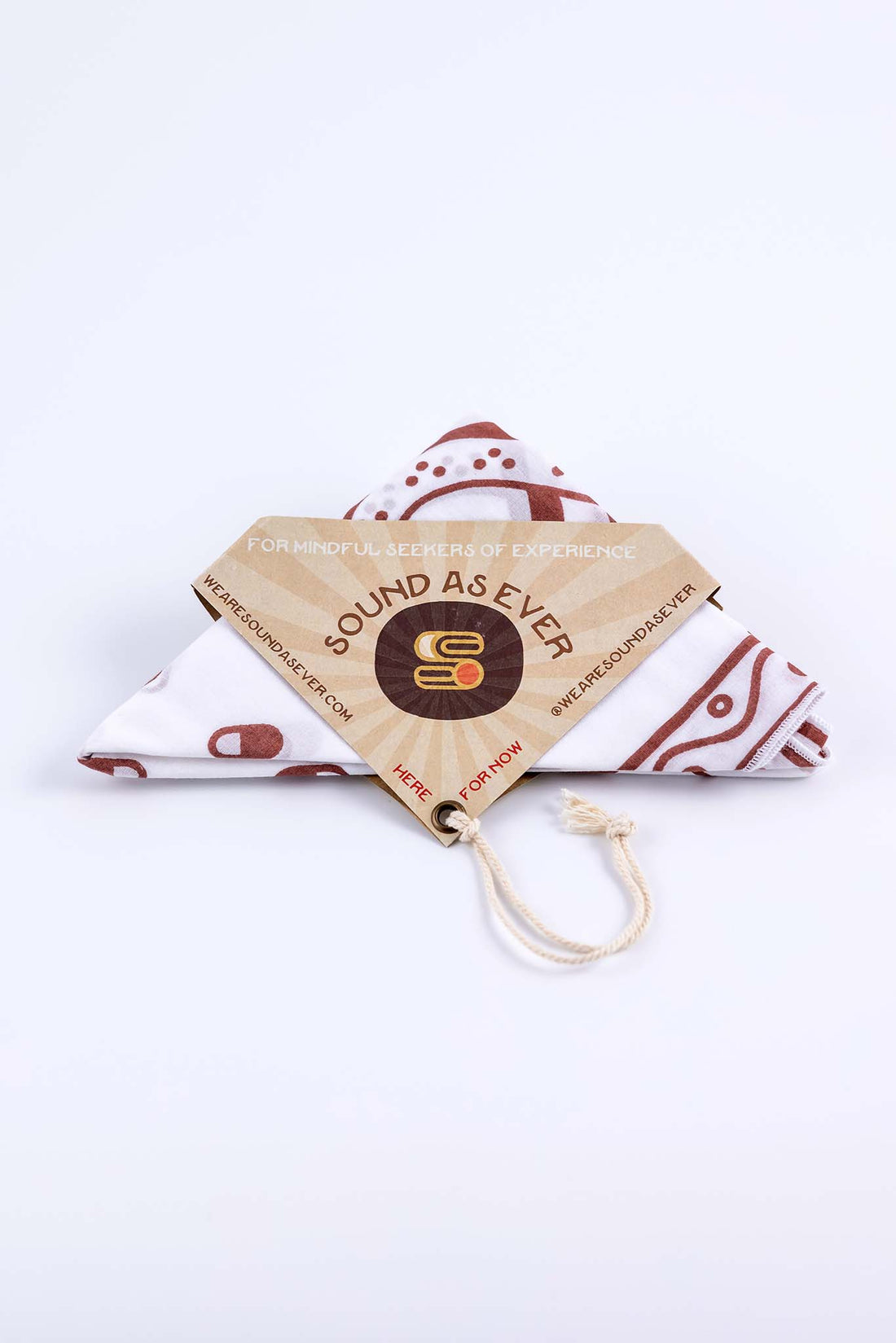 Organic cotton bandana white with red design of the "Sinner Seeker" and folded in a triangle with packaging showing Sound As Ever logo