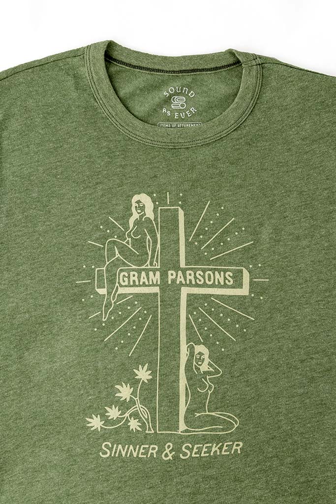 Light green retro graphic tee by Sound As Ever with two women, a cross, and text "Gram Parsons Sinner and Seeker"