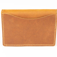 Back of slim bifold leather wallet showing outside quick access pocket