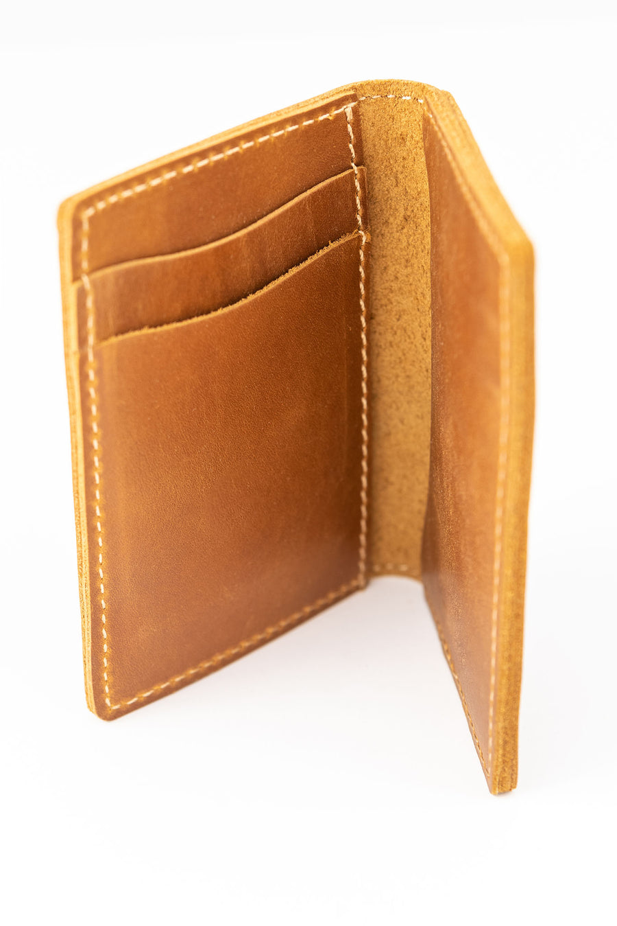 Alternate view of inside pockets of light brown colored slim bifold leather wallet