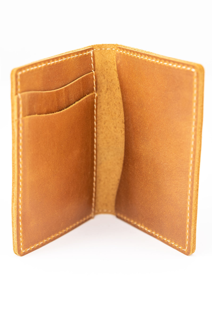 Thin bifold full grain leather wallet open to show card holder and cash pockets