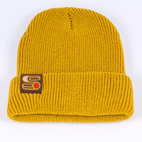 Yellow Sound As Ever beanie with the Sound as Ever logo on a tag