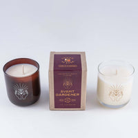 Soy wax candle with option for clear glass or amber brown glass here showing the Avant Gardener scent box