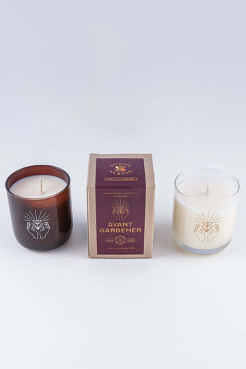Soy wax candle with option for clear glass or amber brown glass here showing the Avant Gardener scent box